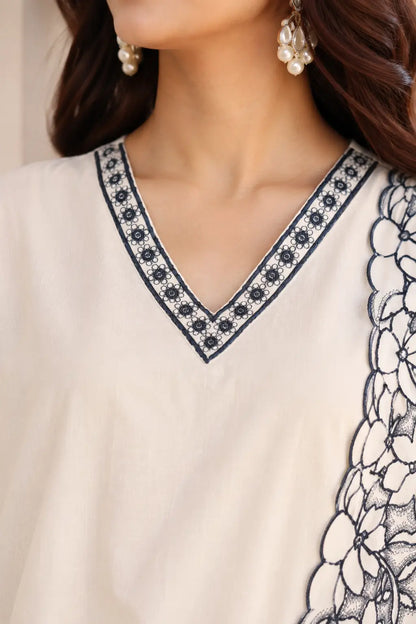 Closeup of Rabric off white cambric cotton V neck kurta design with elegant contrast embroidery for women ethnic wear