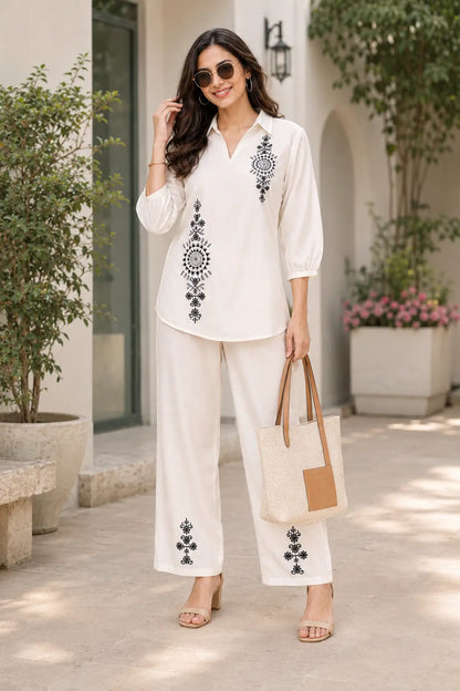 Rabric women’s off white cotton co-ord set with black mandala embroidery, 3/4 sleeve collar top and wide leg pants in cafe lifestyle look