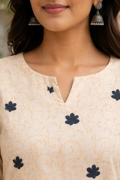 Closeup stylish neck design of Rabric off white cotton printed kurti for women with elegant ethnic detailing