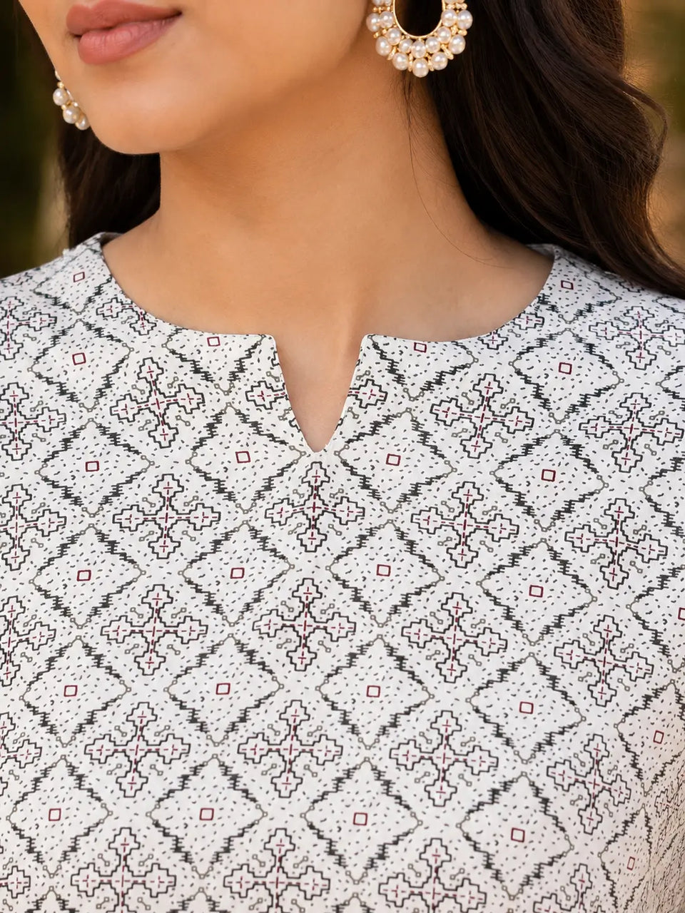 Close up neck design detail of Rabric off white rayon printed kurti with geometric ethnic pattern for women