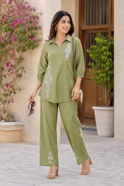 Rabric olive green cotton co-ord set lifestyle look with white mandala floral embroidery, collar top and comfortable wide leg pants