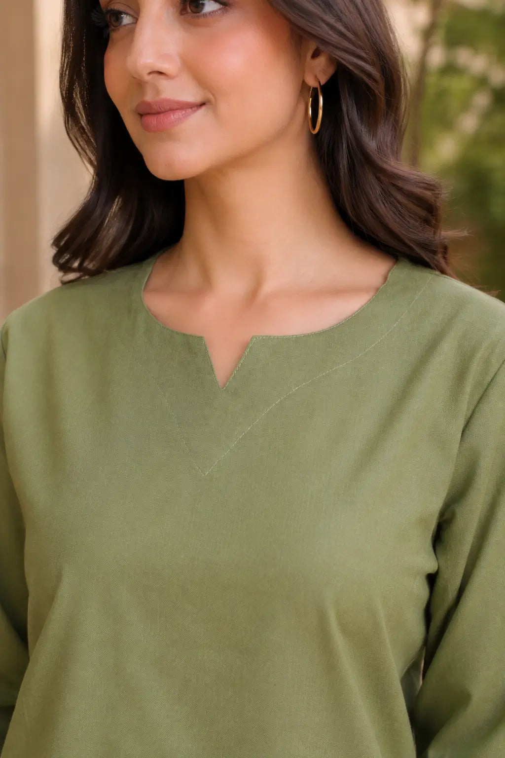 Close-up of Rabric olive green cotton co-ord set neck design featuring V notch neckline, stitch detailing and solid plain fabric