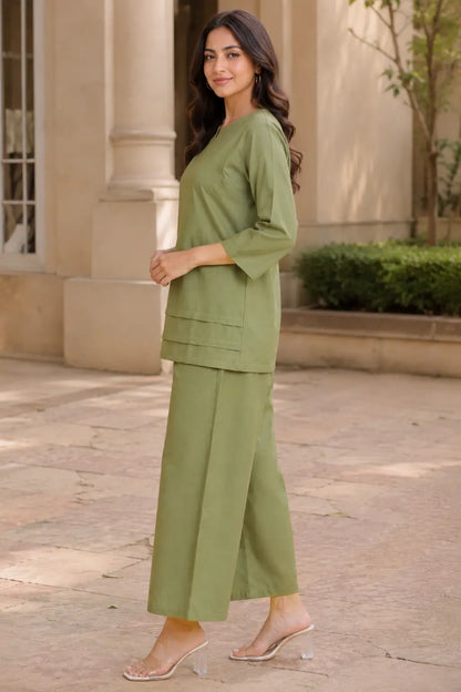 Side view of Rabric olive green cotton co-ord set for women with 3/4 sleeve top, solid plain design and wide leg cotton pant
