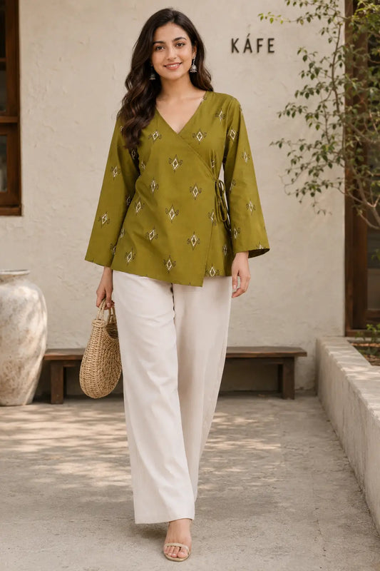 Rabric olive green cotton printed hip length short top for women styled in casual walking look with stylish bottom
