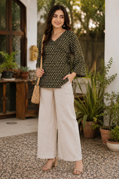 Rabric olive green Cotton floral printed short top styled with cream palazzo, jhumka earrings and casual accessories for women.