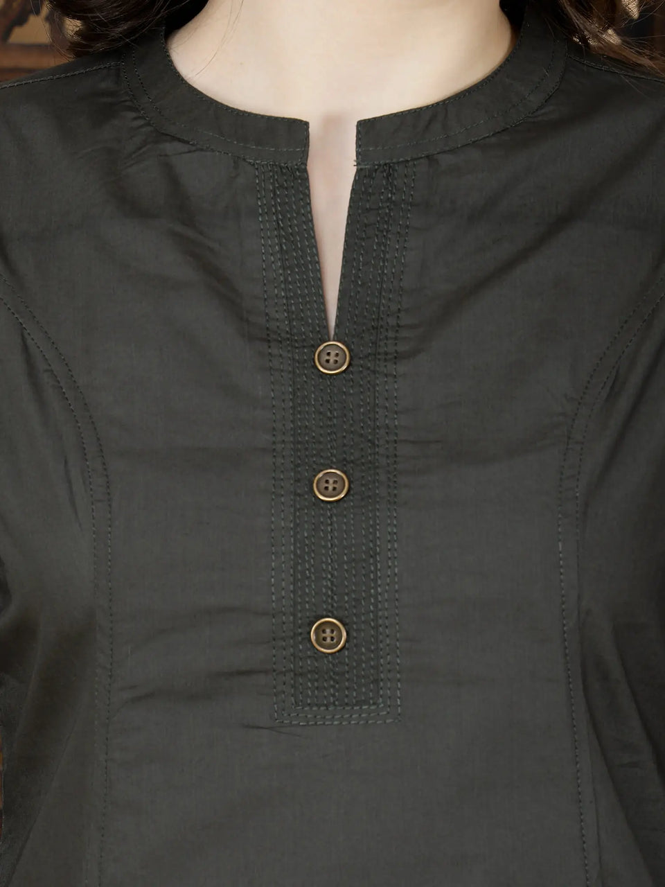Close-up of brass buttons and thread work on Rabric Olive Green Kurti