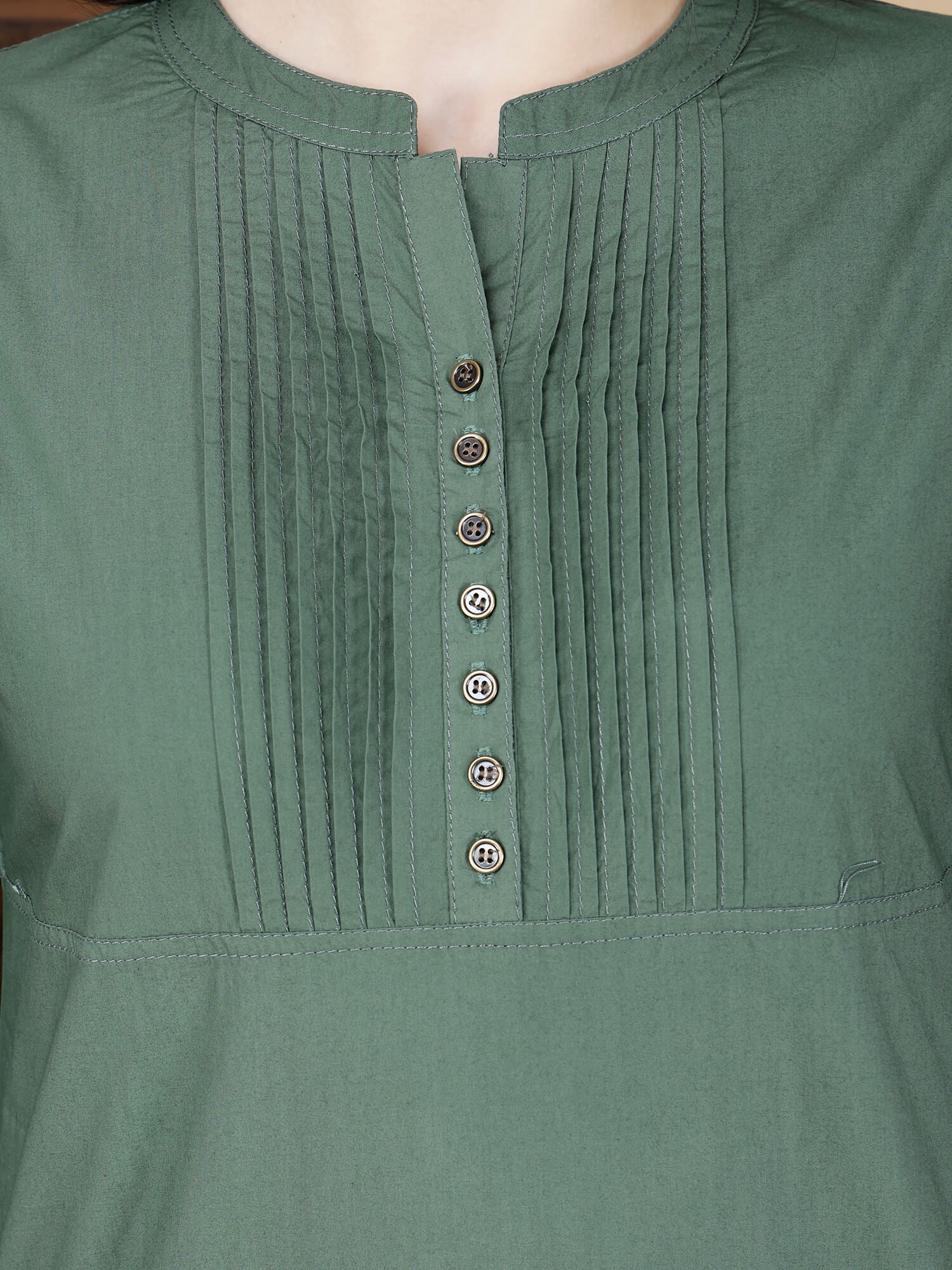 Close-up of pintuck design and brass button details on Rabric Poplin Cotton Kurti