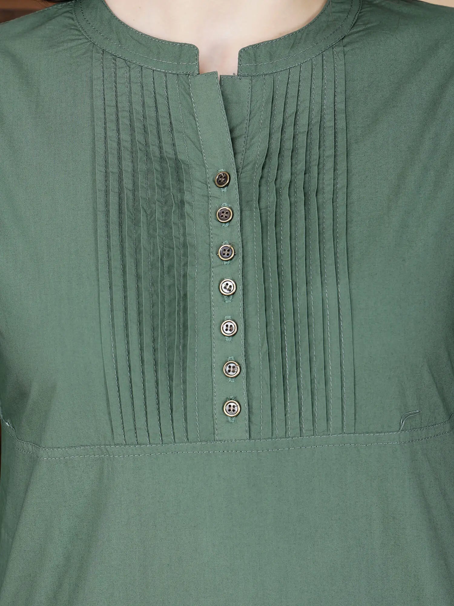 Close-up of pintuck design and brass button details on Rabric Poplin Cotton Kurti