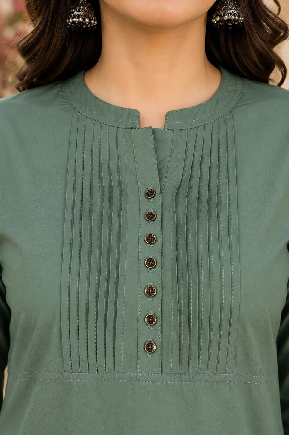 Closeup neck design of Rabric olive green popline cotton kurti featuring stylish pintuck detailing and button placket