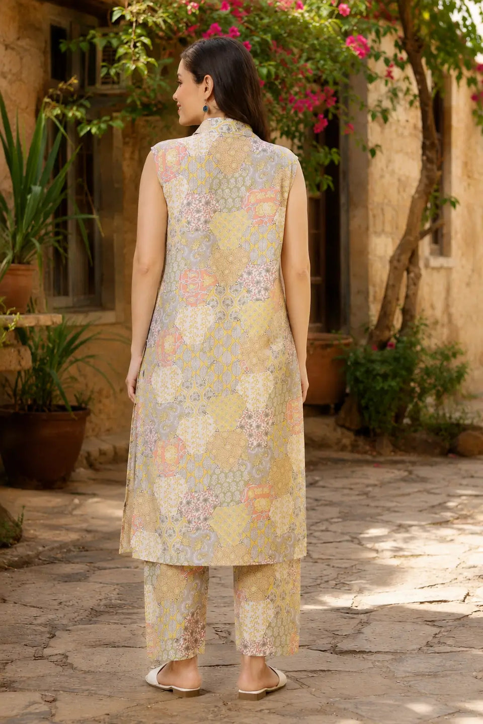 Back view of RABRIC pastel printed women co-ord set with sleeveless long kurta and straight pants