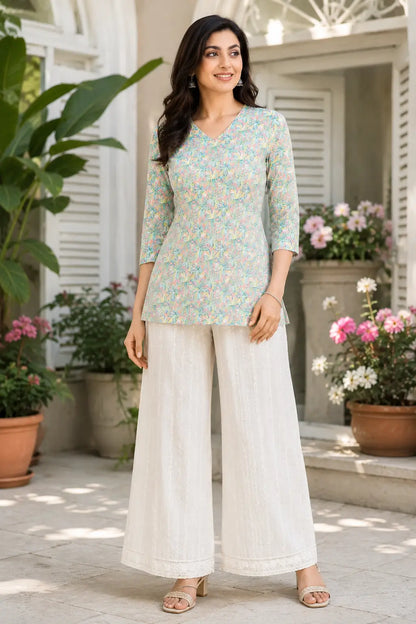 Rabric pastel pink mint floral cotton short top for women front view with V neck and 3-4 sleeves paired with white palazzo pants