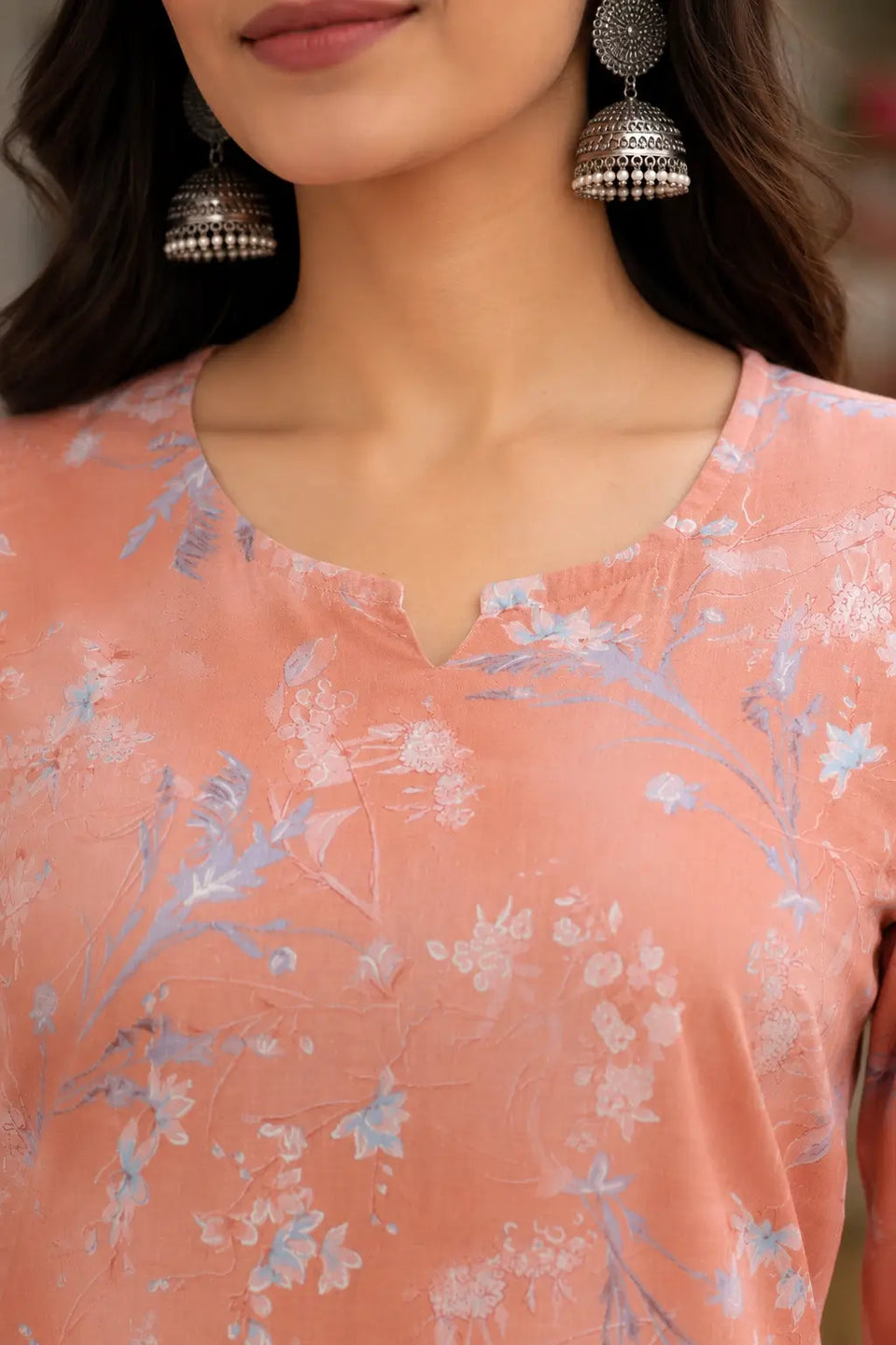 Close up neck design detail of Rabric peach cambric cotton floral kurta for women with elegant round neckline