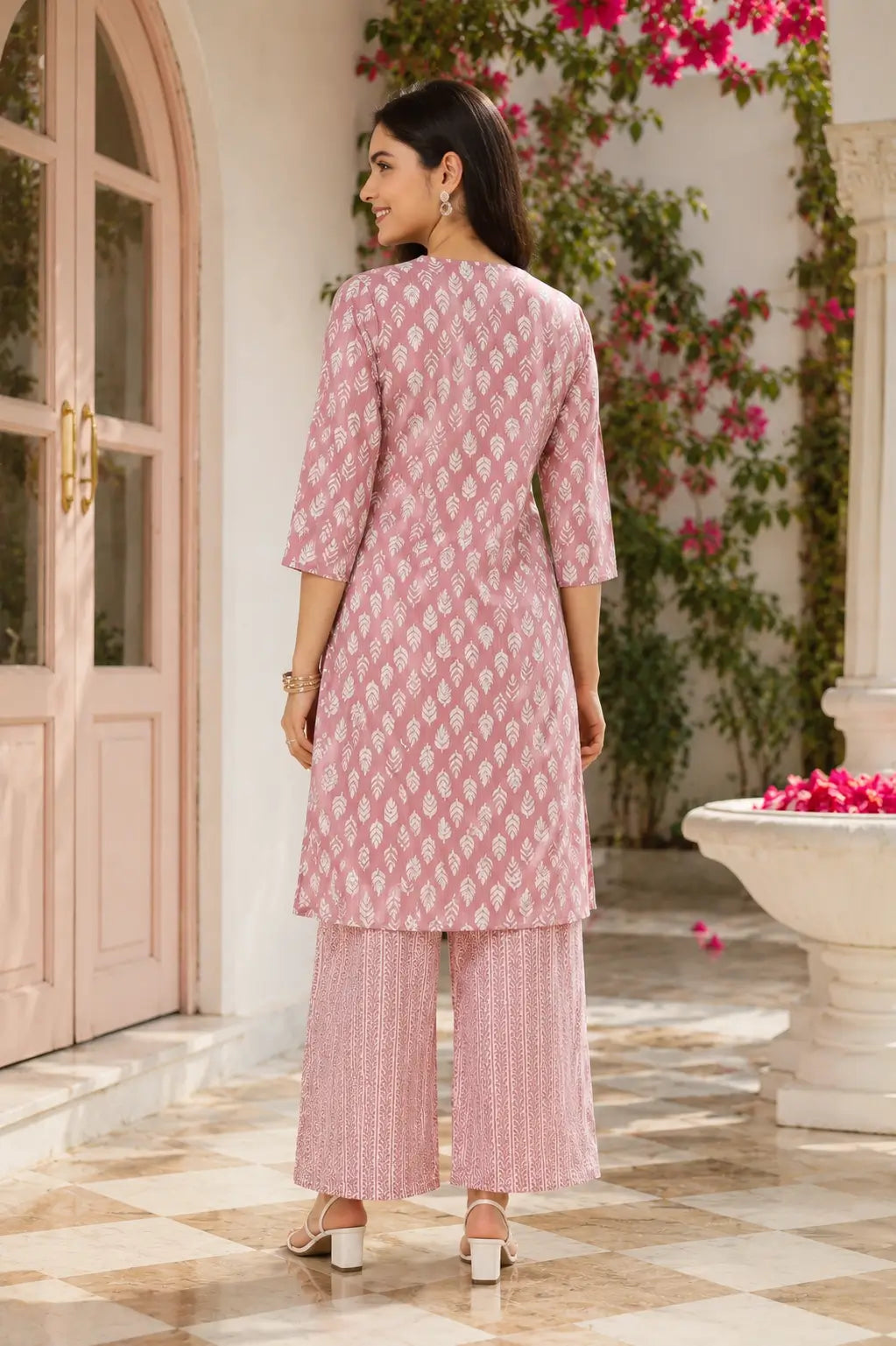 Back view of Rabric women pink cotton kurta pant set with 3-4 sleeves and printed palazzo pants