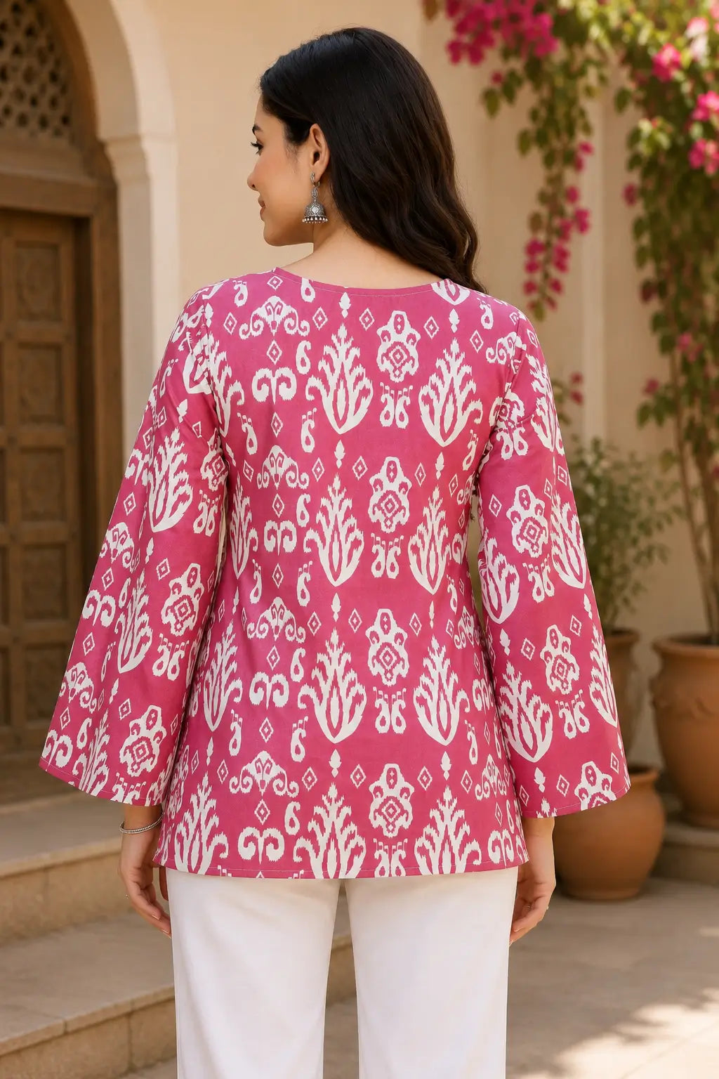 Back view of RABRIC pink ethnic printed women’s tunic top with flared sleeves