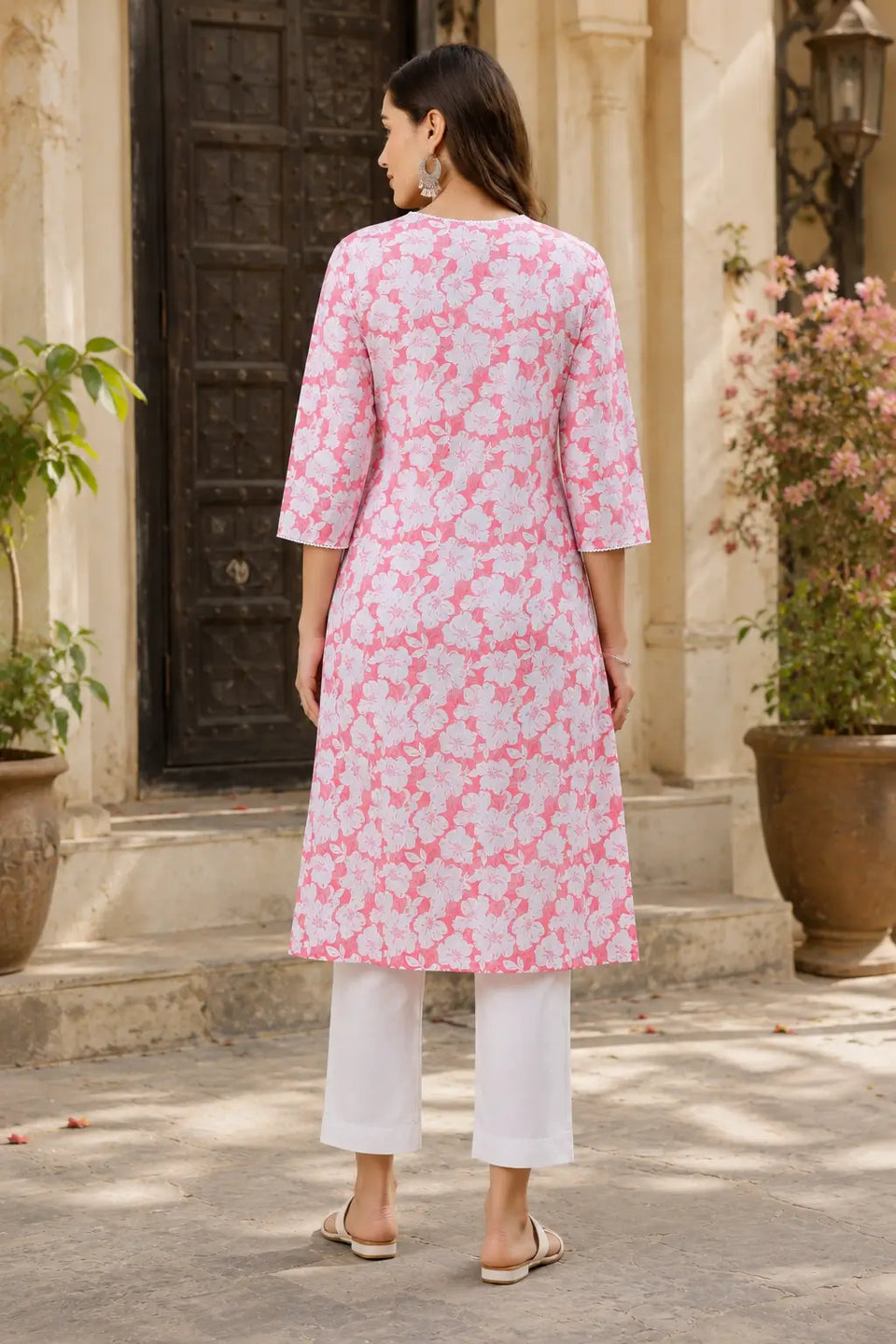 Back side view of Rabric pink floral cotton kurti for women with elegant straight fit and 3/4 sleeves