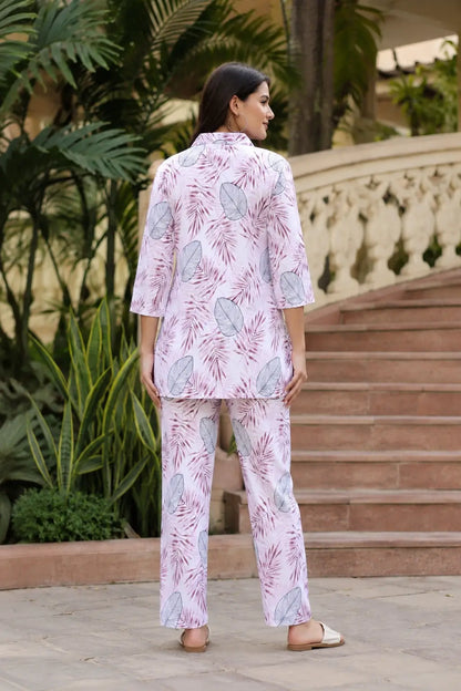 Back view of Rabric women pink rayon co-ord set featuring botanical palm leaf print, 3-4 sleeves shirt and comfortable straight fit pants