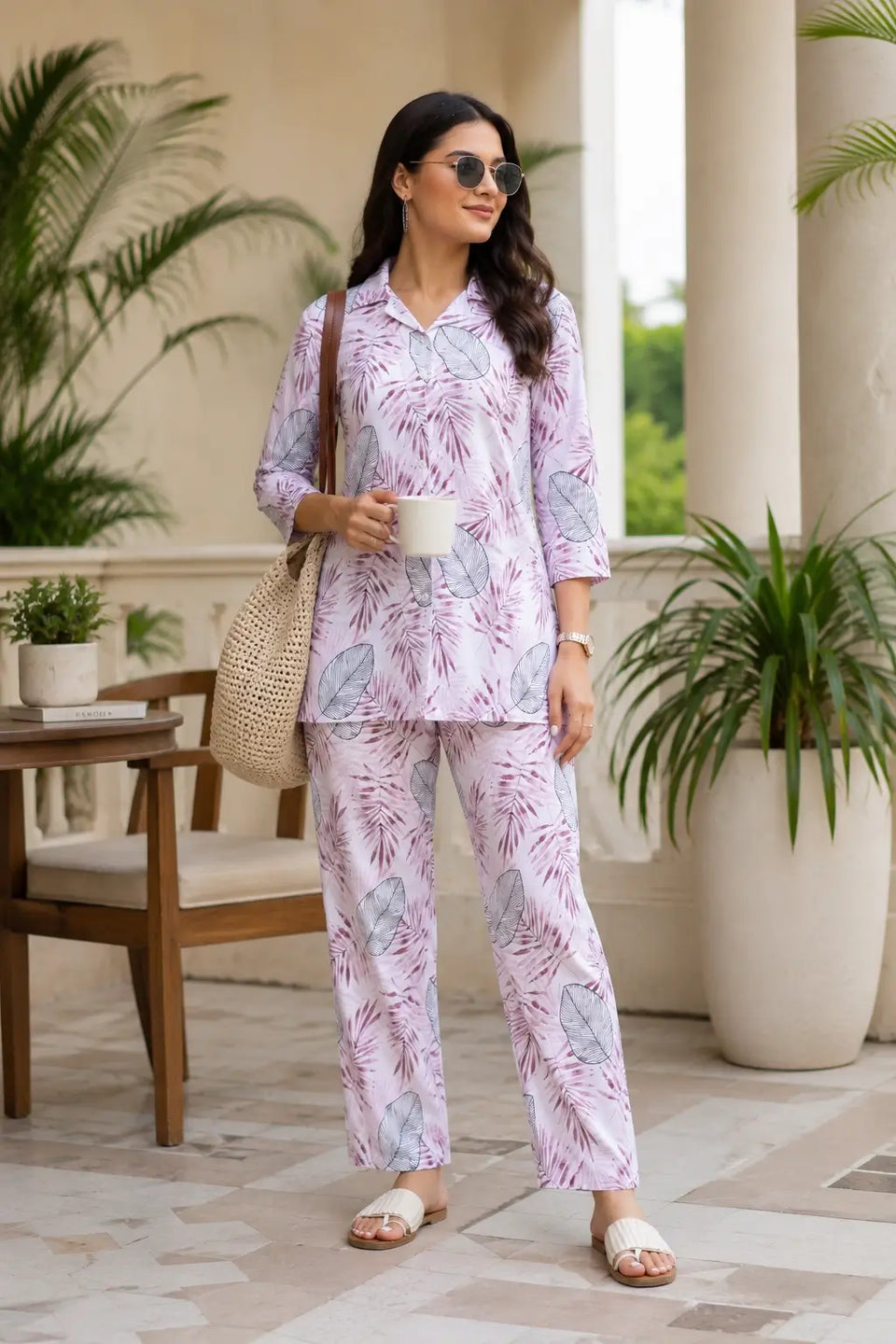 Rabric women pink rayon lounge co-ord set styled outdoors with tropical leaf print, casual summer fashion outfit for women