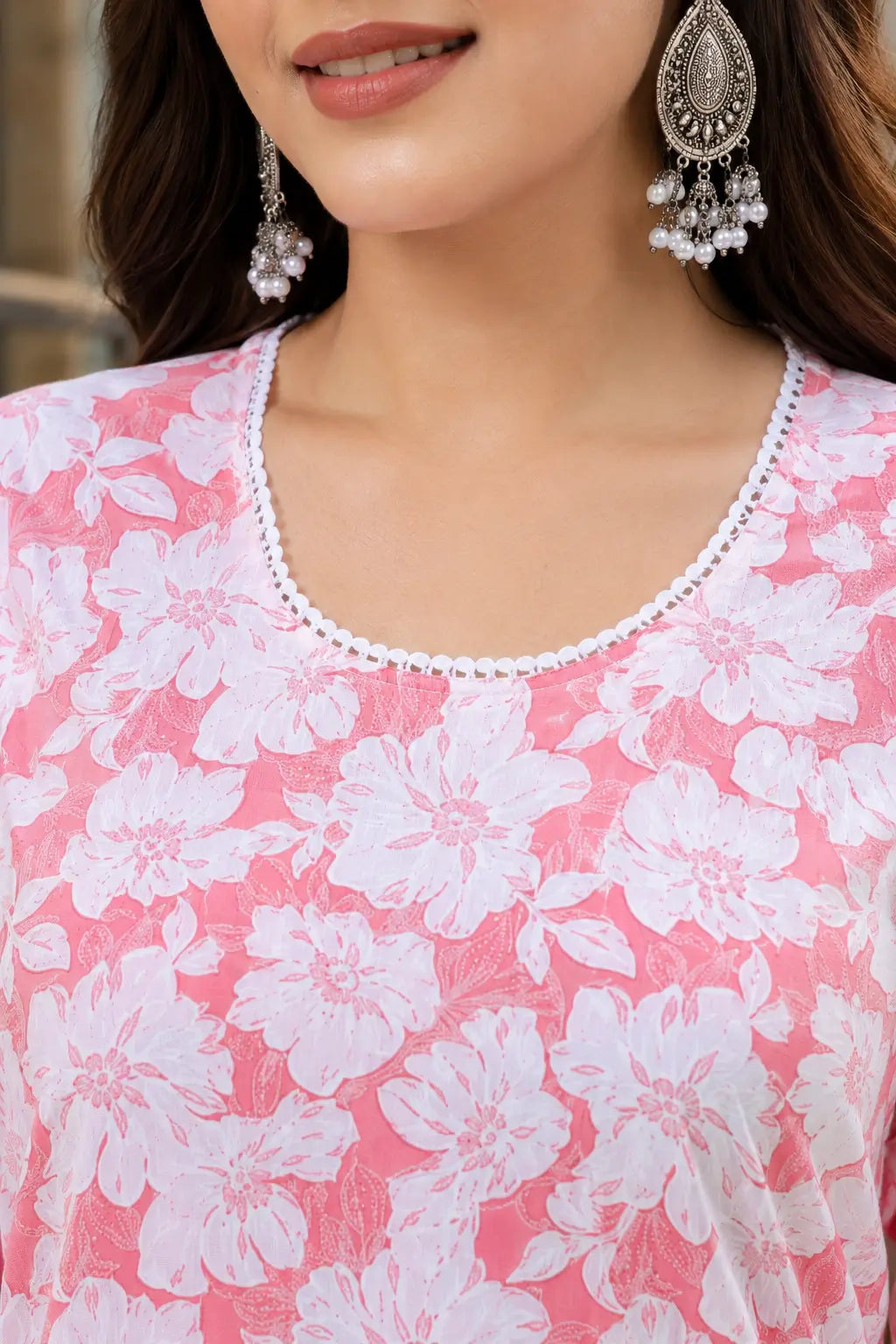 Closeup of stylish round neck design on Rabric pink white floral cotton kurti for women