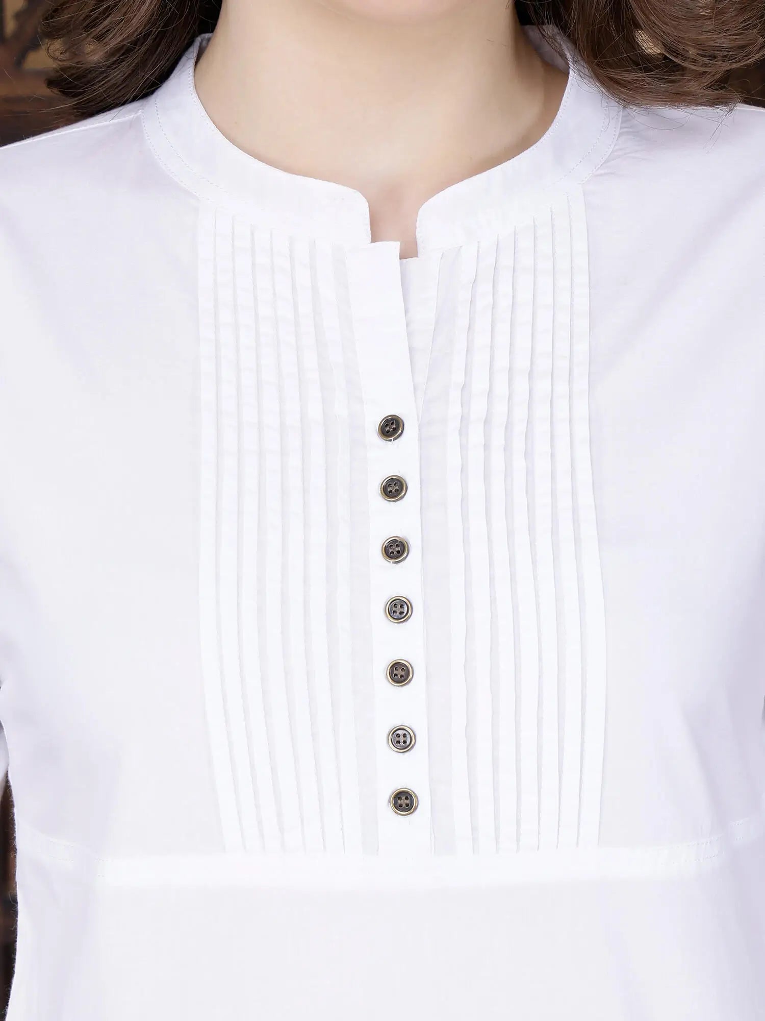 Close Up of Pintuck Neckline and Brass Buttons on White Kurti
