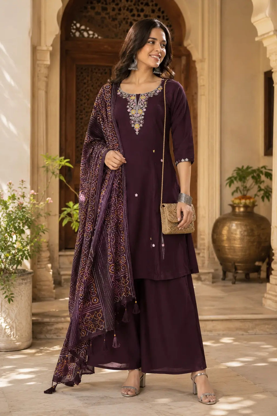 Elegant women’s plum cotton ethnic kurta set with dupatta by Rabric styled with silver accessories for festive wear