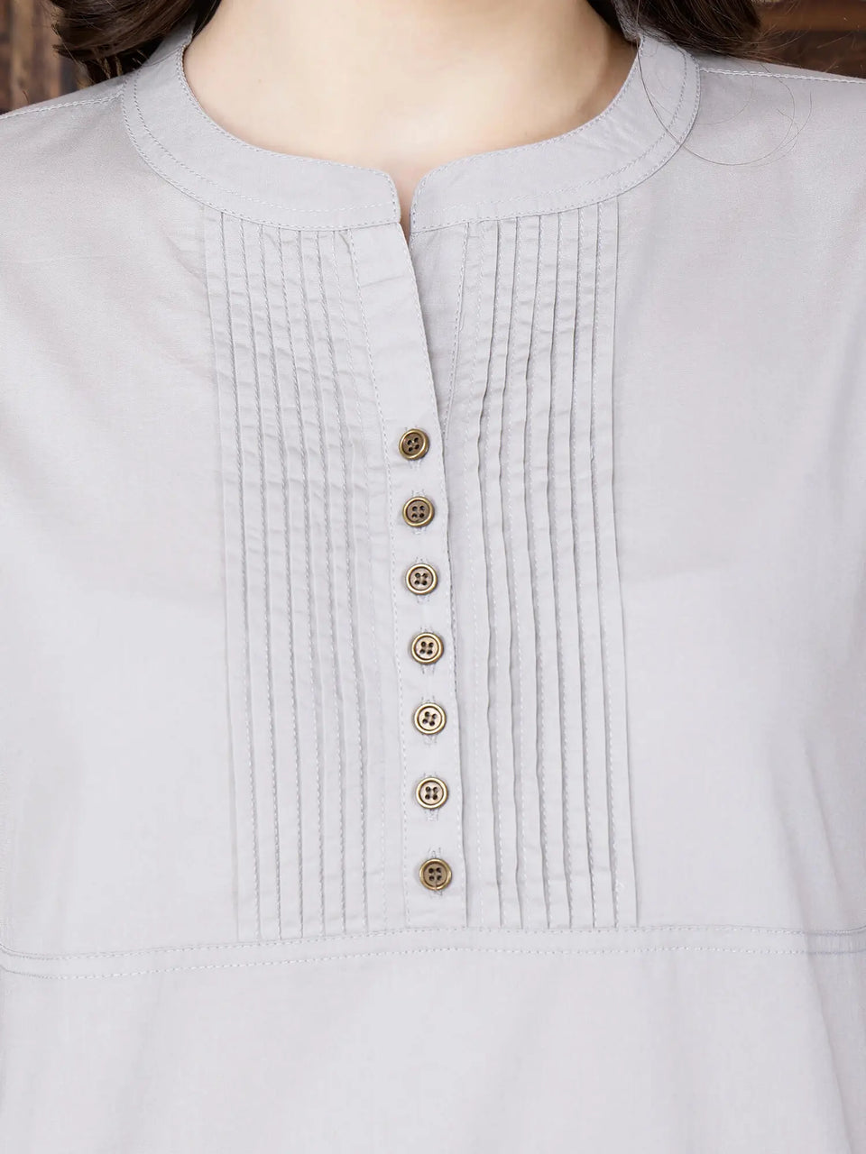 Close-up of brass button design on Rabric premium cotton kurti