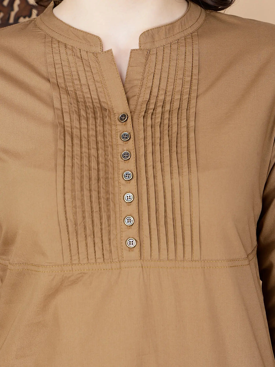 Close-up of brass button detailing on Rabric poplin cotton kurti
