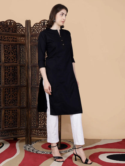 Detailed view of brass button embellishment on black kurti
