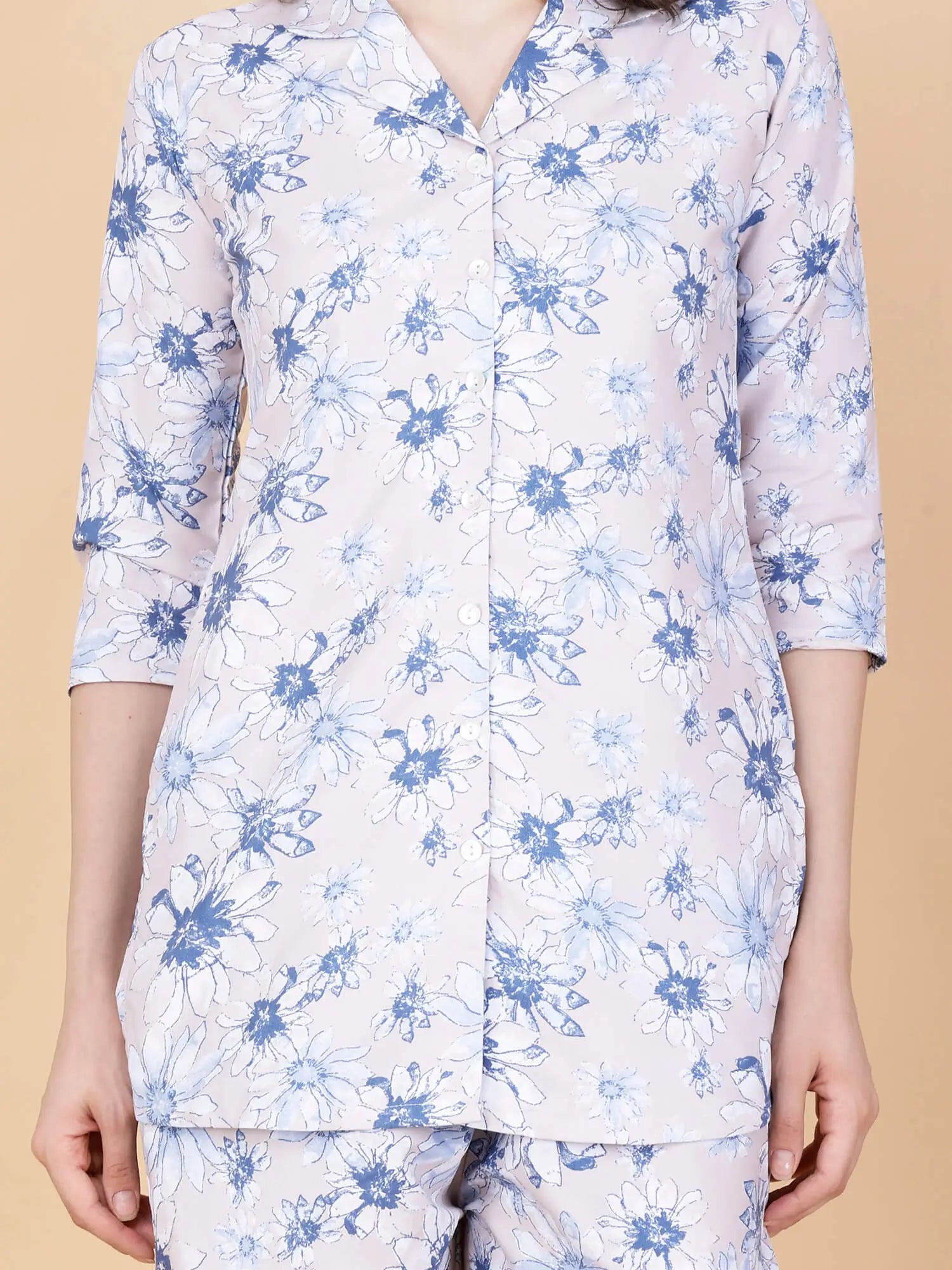 Close-up of premium glace cotton floral print fabric in pink and blue