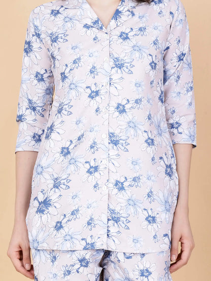 Close-up of premium glace cotton floral print fabric in pink and blue