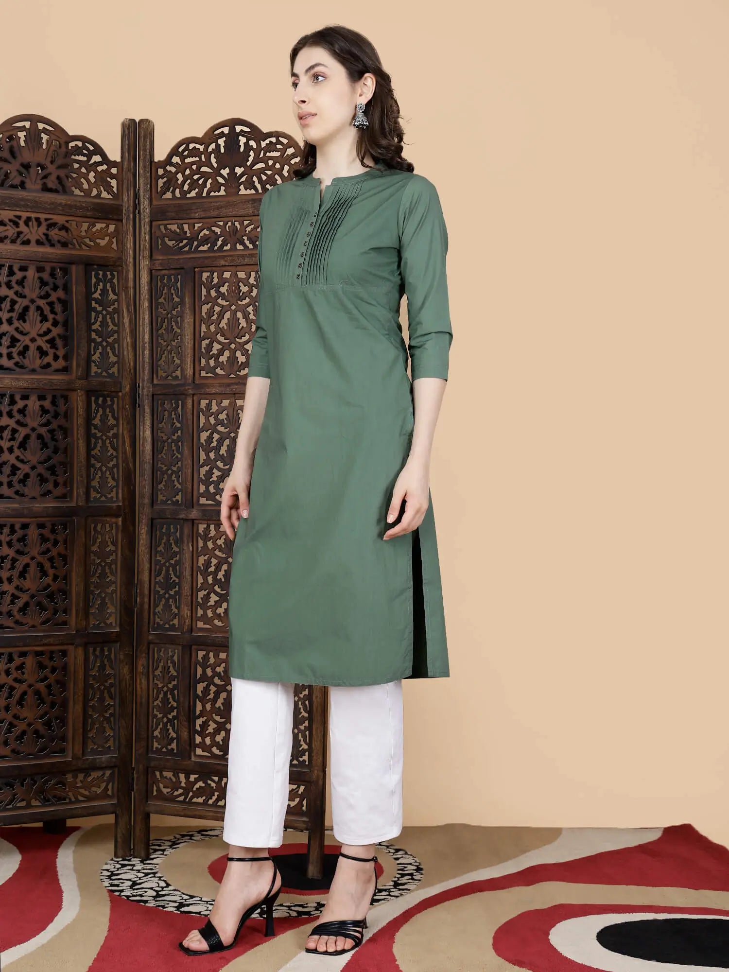 Olive Green Kurti paired with white pants styled by Rabric