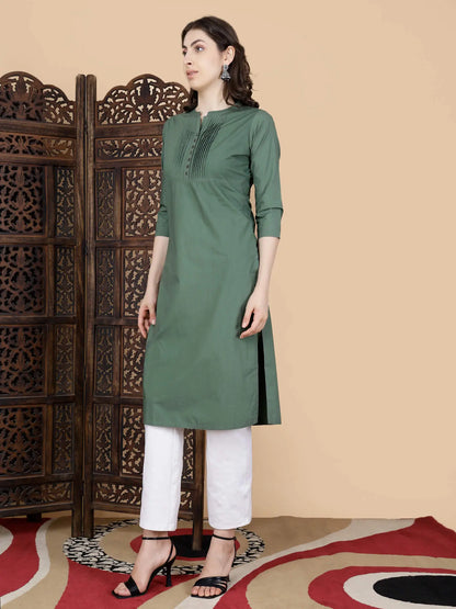 Olive Green Kurti paired with white pants styled by Rabric