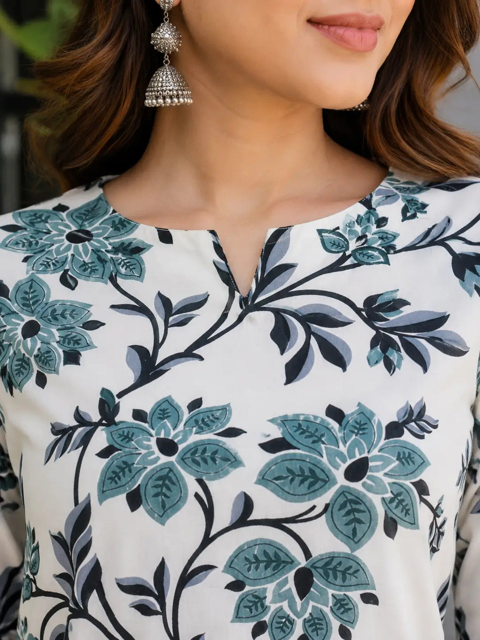 Close up neck design of Rabric off white teal floral printed rayon co-ord set for women with elegant neckline detail