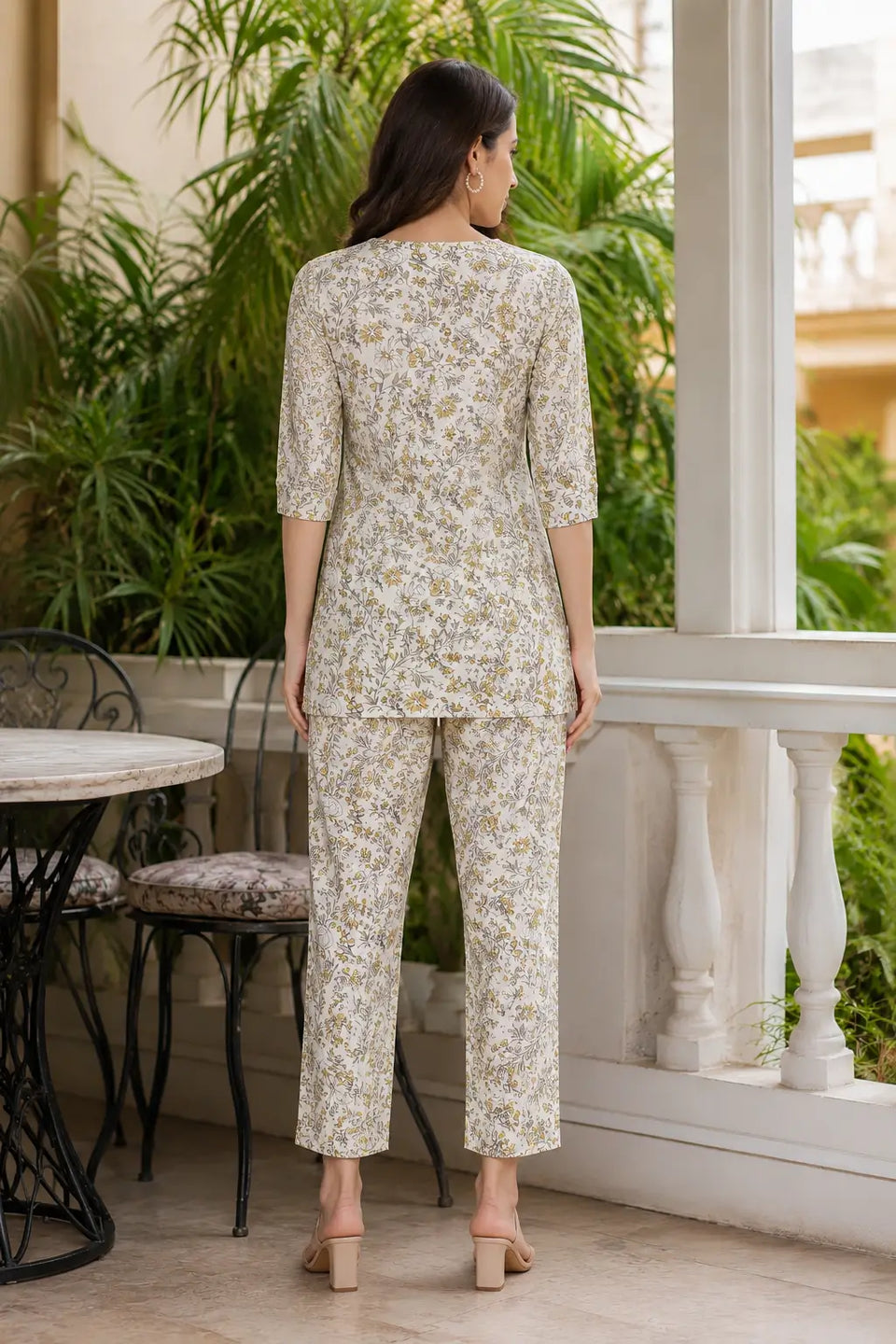 Back view of Rabric off white yellow floral printed rayon co-ord set for women featuring short kurti and straight pants with elegant floral design