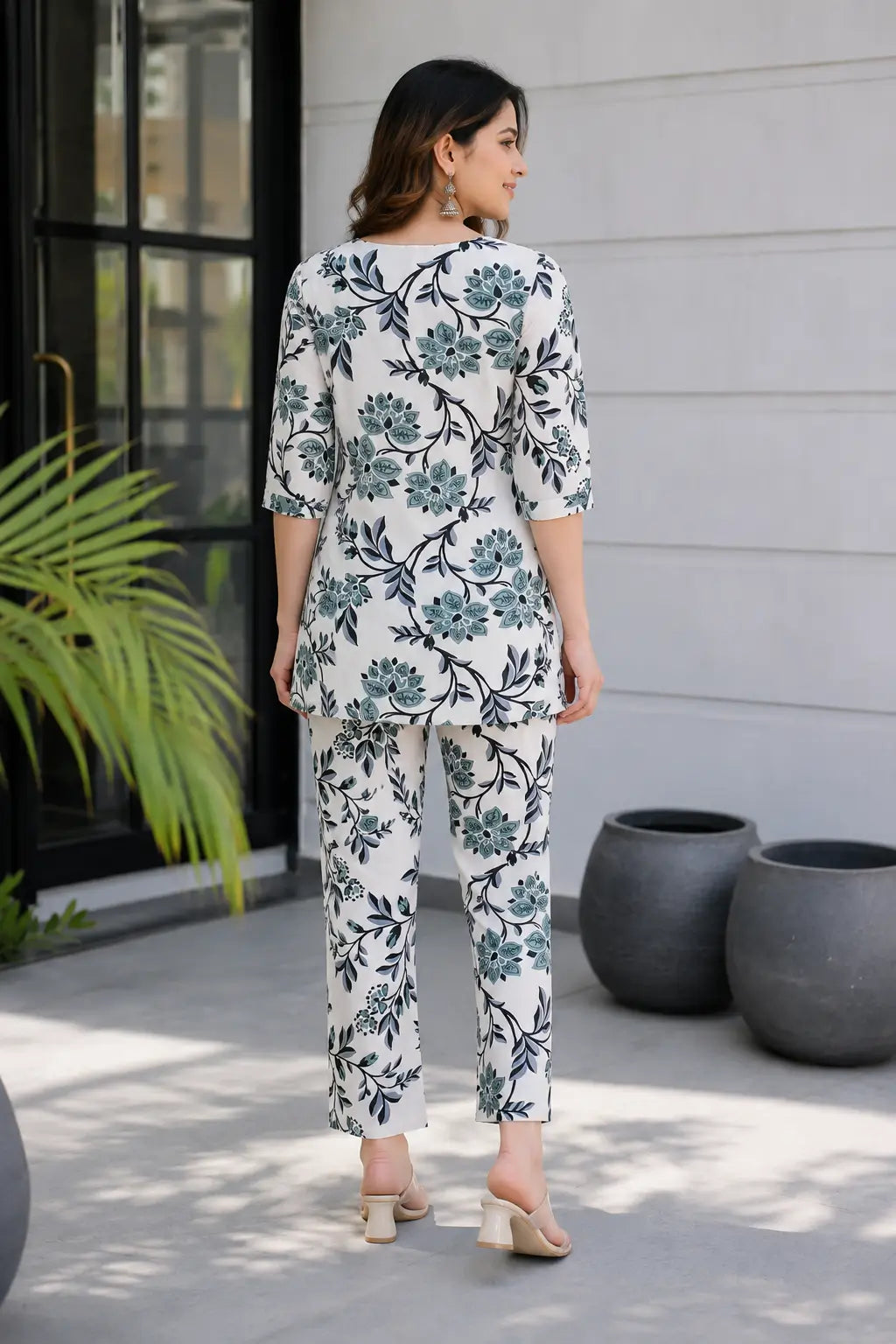 Back view of Rabric women rayon floral co-ord set in off white and teal color with straight fit pants and short kurti style top
