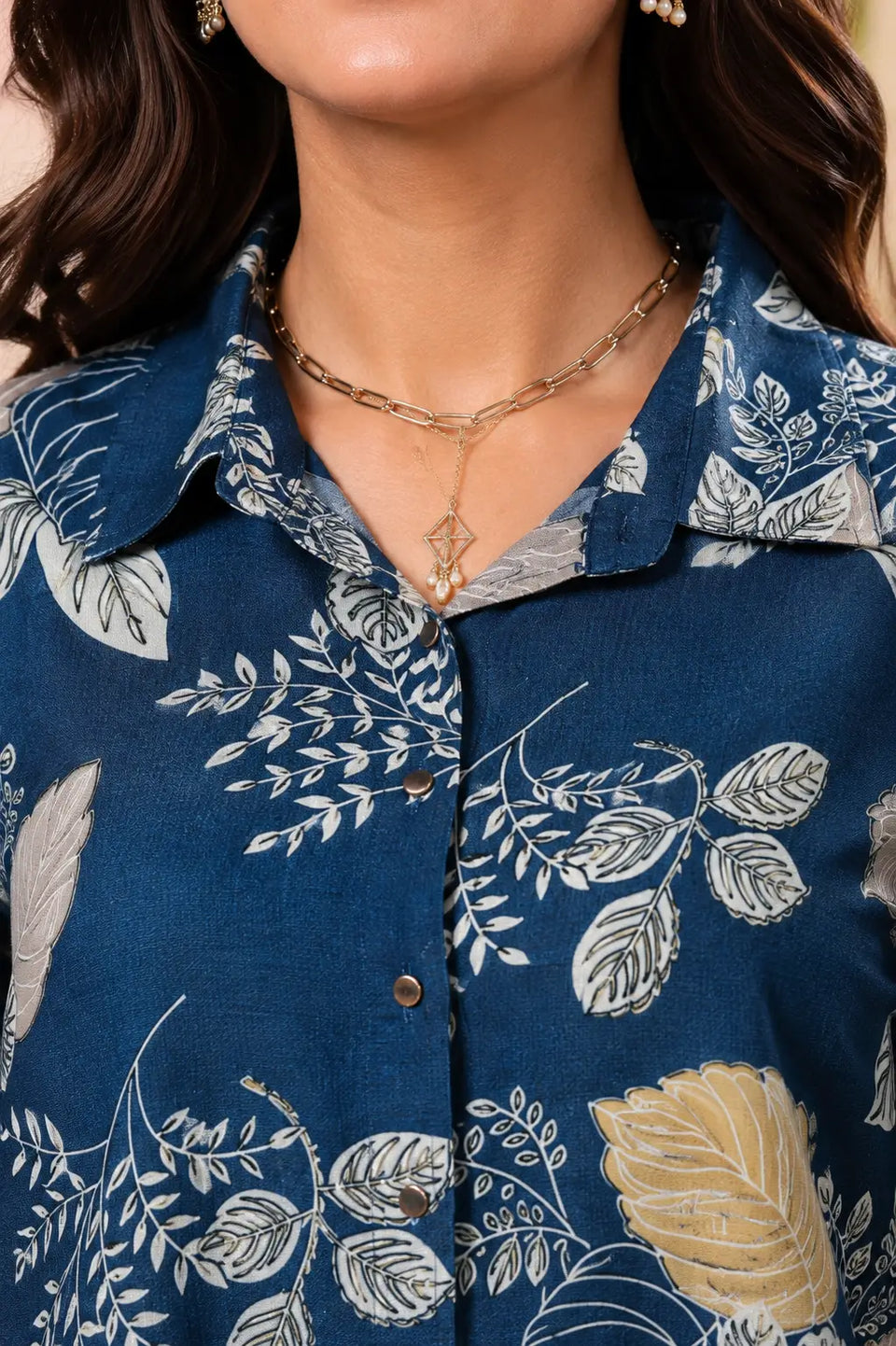 Closeup of Rabric rayon floral printed women co-ord set shirt collar neck design in navy blue fabric