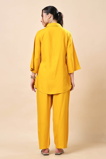 Back view of mustard yellow co-ord set with relaxed trousers