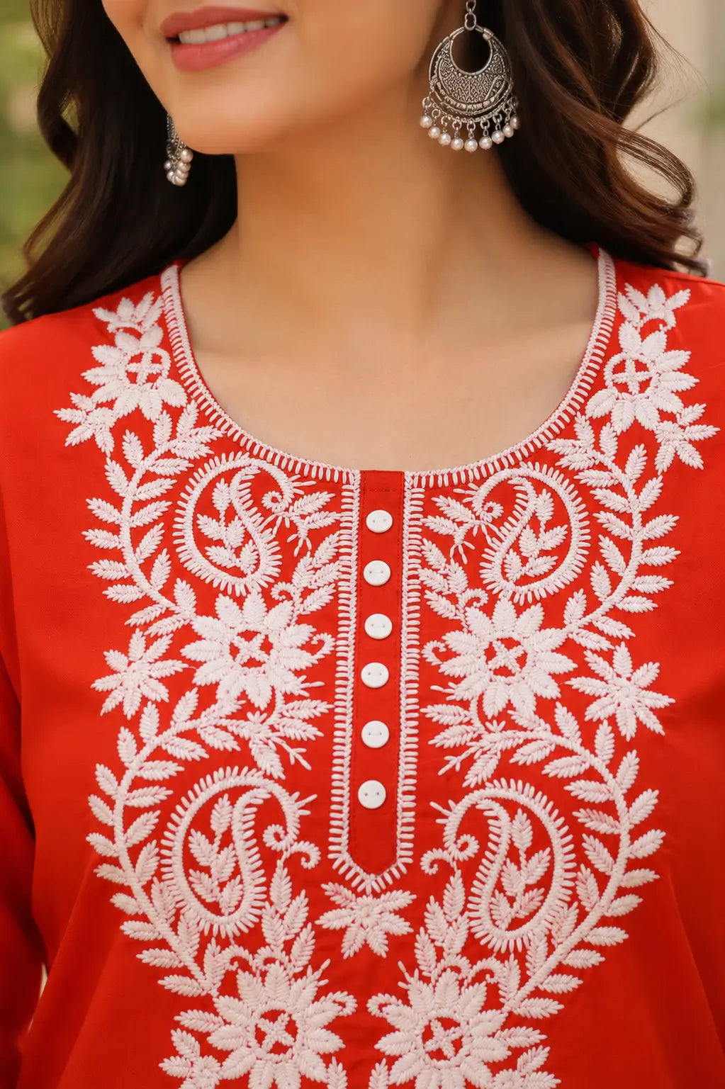 Closeup neck embroidery design on red cotton short kurti for women by Rabric with floral thread work