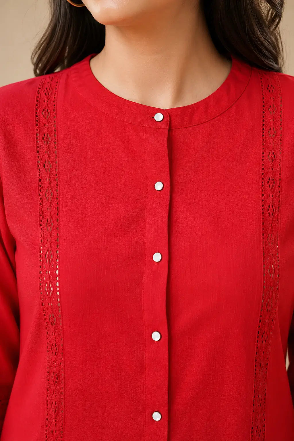 Close-up of Rabric red Vertican Silk co-ord set showing round neckline, button front placket and intricate lace detailing on shirt panel.