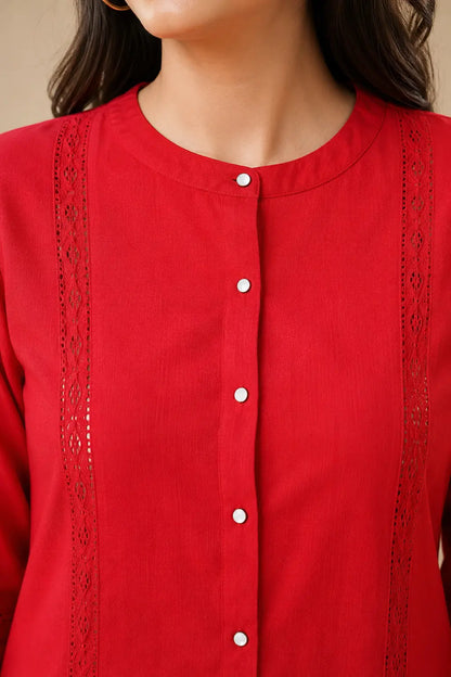 Close-up of Rabric red Vertican Silk co-ord set showing round neckline, button front placket and intricate lace detailing on shirt panel.