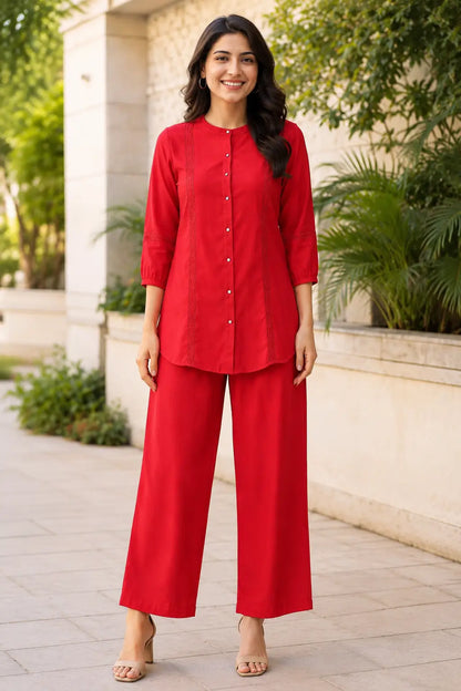 Rabric red Vertican Silk women's co-ord set front view featuring solid red shirt with lace panel detailing, round neckline, 3-4 sleeves and matching wide-leg pants.