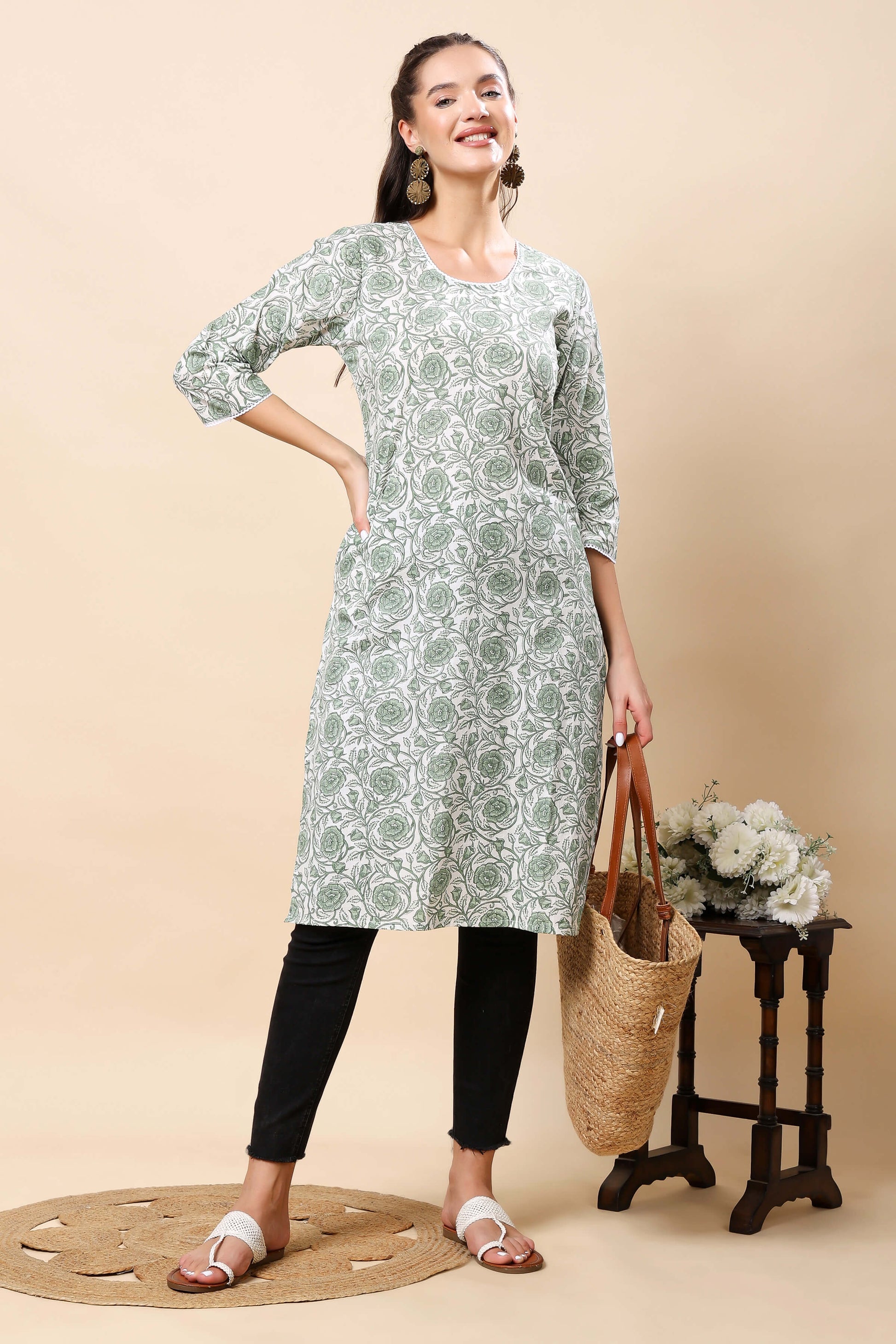 Close-up of round neck with lace detailing on Rabric floral kurti