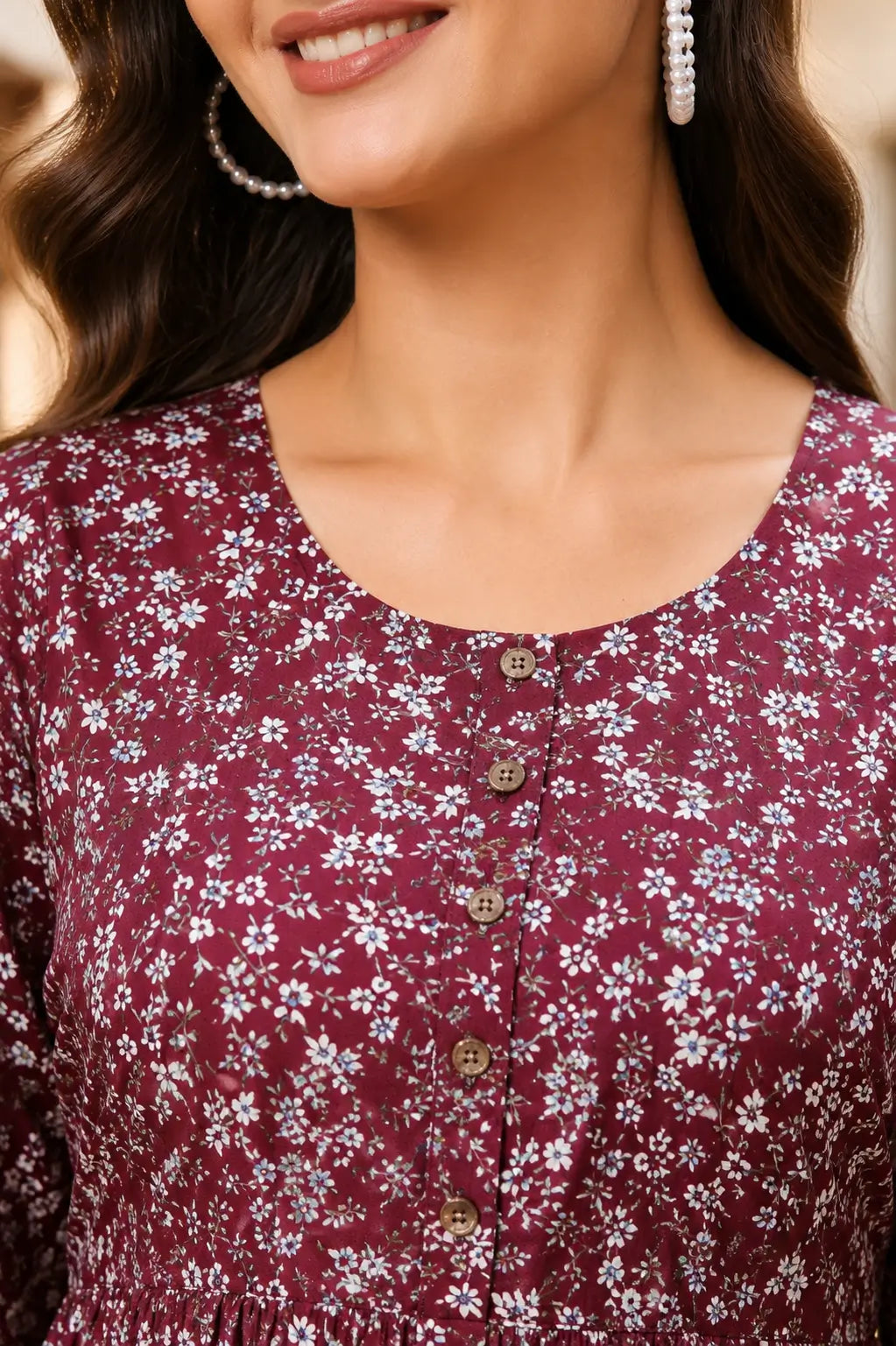 Close up neck design of Rabric maroon floral crepe kurti featuring round neck and button detailing