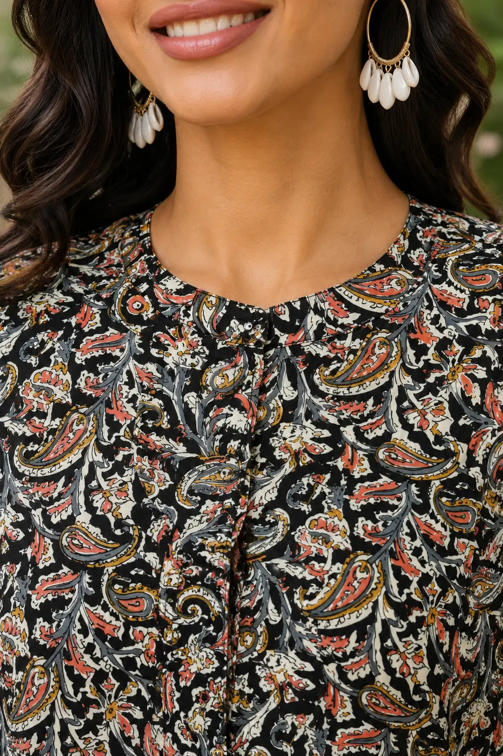 Closeup neck design of Rabric black paisley cotton short top with round neckline and front button placket