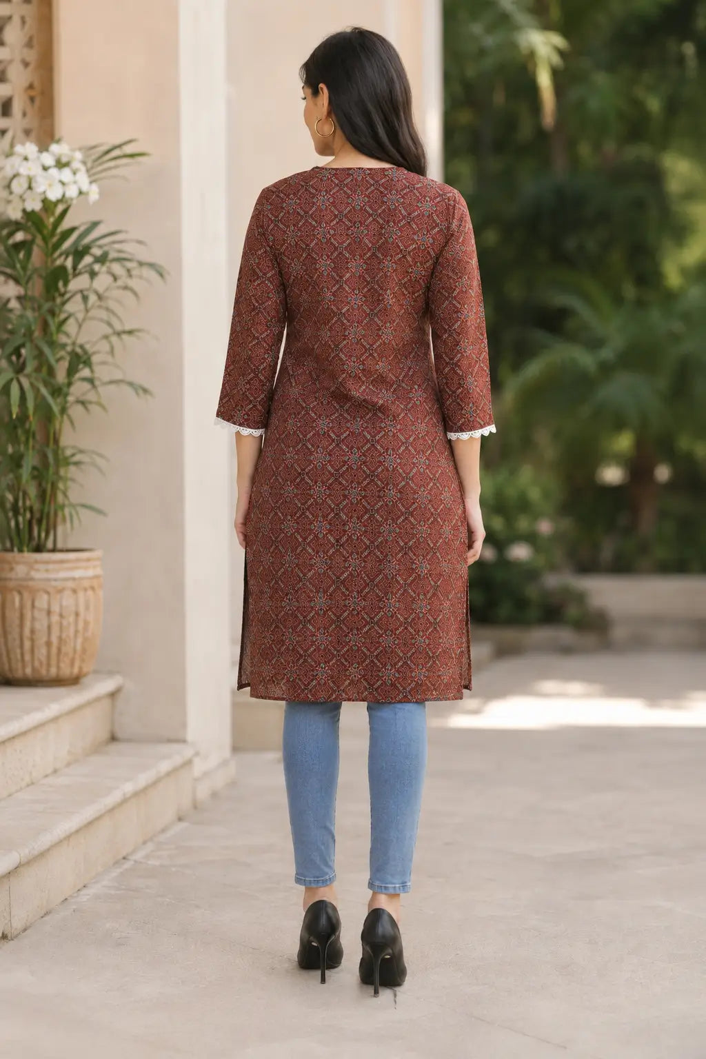 Back view of Rabric rust brown cotton long kurti for women featuring ethnic geometric floral print, straight fit and three-quarter sleeves
