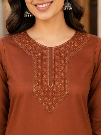 Closeup of embroidered stylish neck design on rust brown Tencel women kurti by Rabric