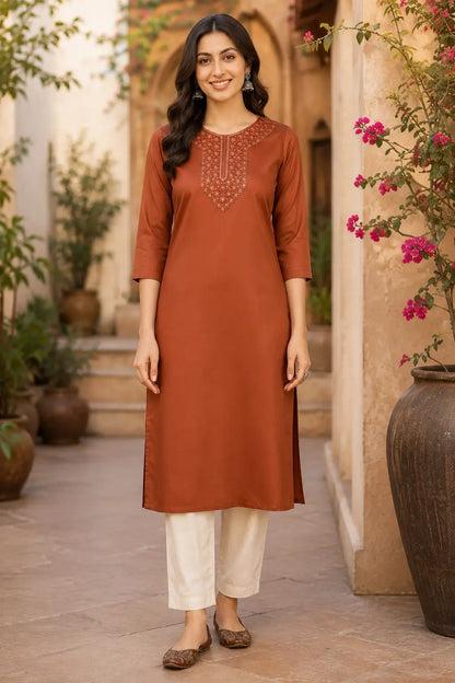 Woman wearing rust brown Tencel kurti by Rabric in casual lifestyle look with stylish accessories and ethnic fashion styling