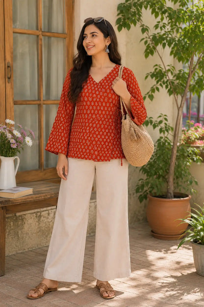 Rabric rust red cotton floral print short top for women with V neck and full bell sleeves front view