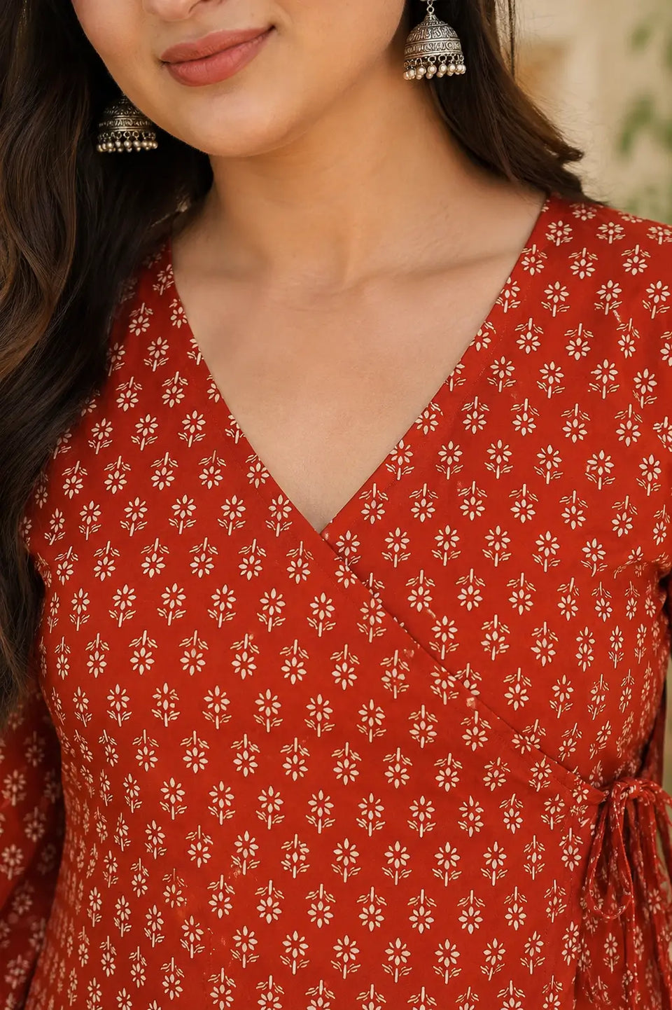 Rabric rust red cotton floral print short top V neck design close up for women