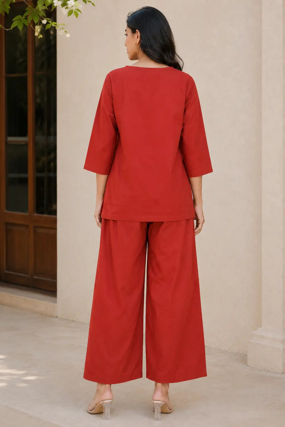 Rabric rust red cotton plain co-ord set for women back view with 3/4 sleeve top and wide palazzo pants