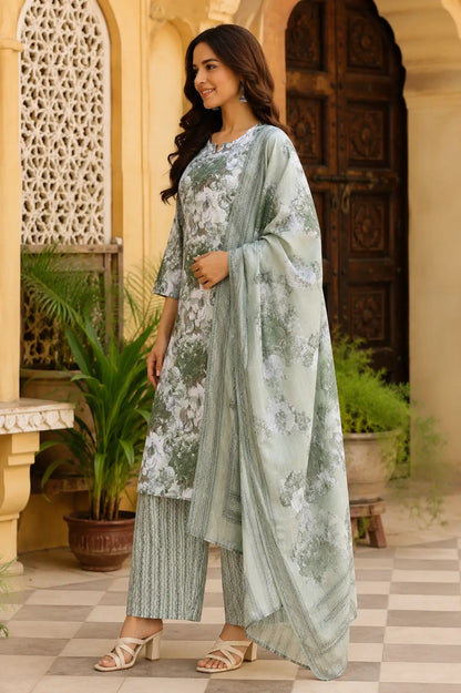 Side angle view of Rabric sage green cambric cotton floral kurta pant set with printed dupatta and elegant 3-4 sleeves